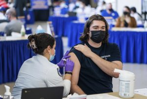 Pitt student Michael Burke, 21, gets a COVID-19 booster shot on January 21 in Oakland, Pennsylvania. The CDC withheld data about the effectiveness of the boosters for people aged 18-49 - the least likely to benefit